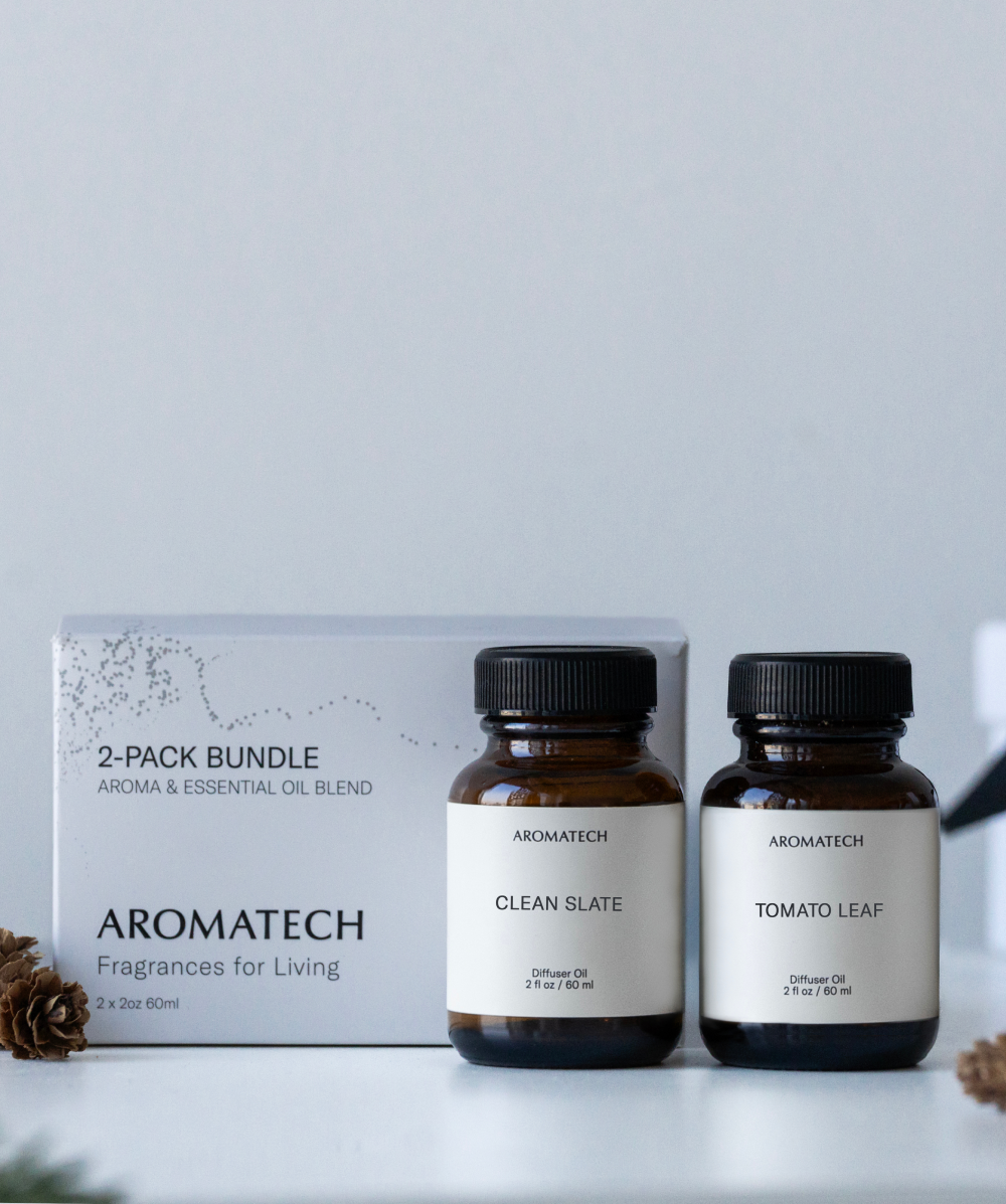 Aromatech 2-pack fragrance bundle with a white box and two amber glass bottles labeled Clean Slate and Tomato Leaf